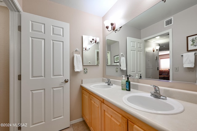 bathroom featuring double vanity and tile floors