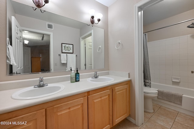 full bathroom featuring double vanity, toilet, tile floors, and shower / bath combo with shower curtain