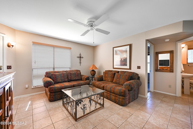 tiled living room with ceiling fan