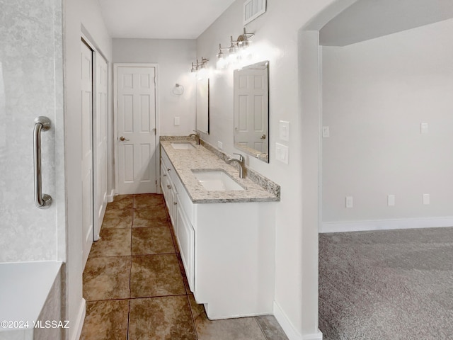 bathroom with tile floors and double vanity