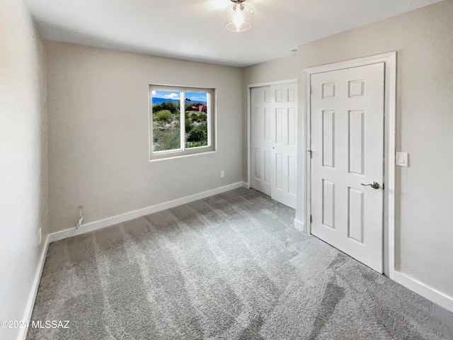 unfurnished bedroom with light carpet