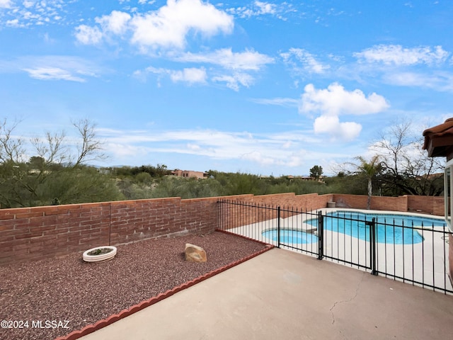 view of pool featuring a patio area