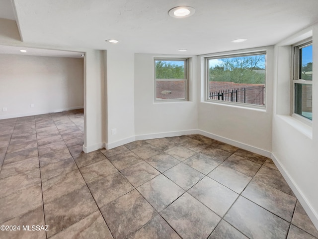 spare room with light tile flooring