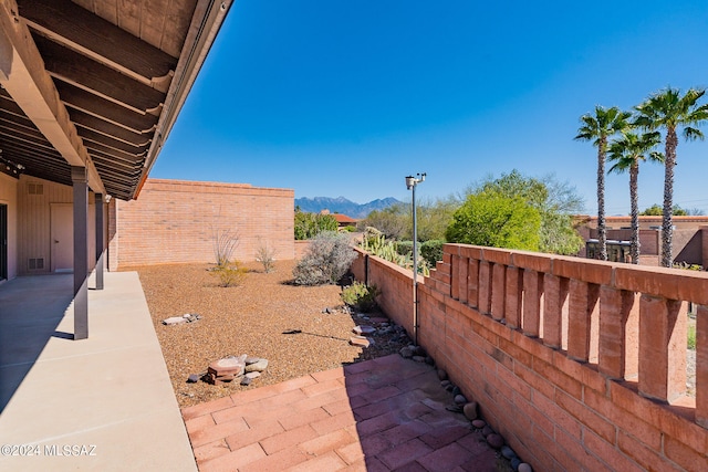 view of terrace with a mountain view