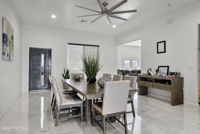 dining area featuring ceiling fan and light tile floors