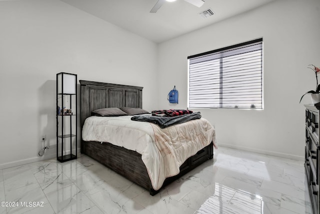 tiled bedroom featuring ceiling fan