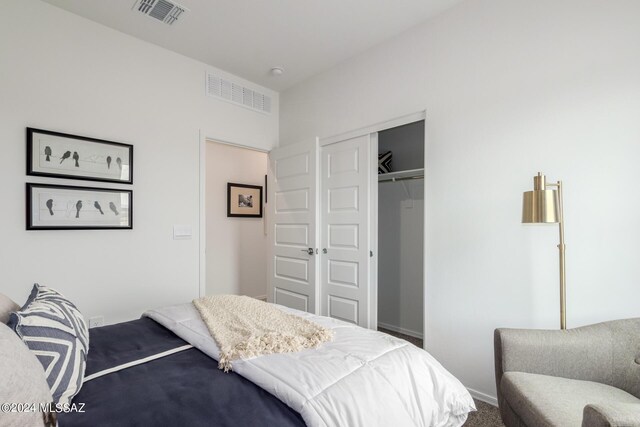 bedroom with carpet floors and a closet