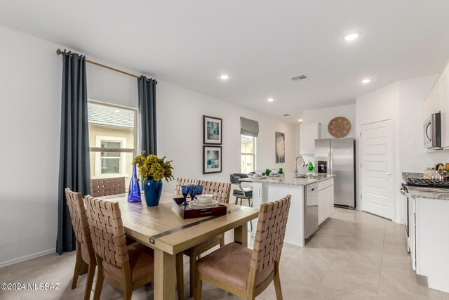 dining space featuring sink