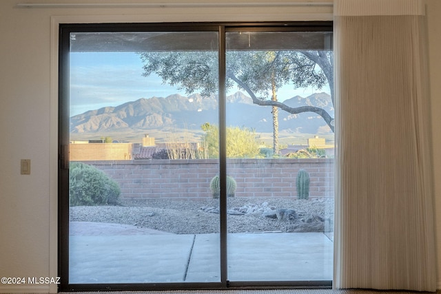 doorway to outside featuring a mountain view