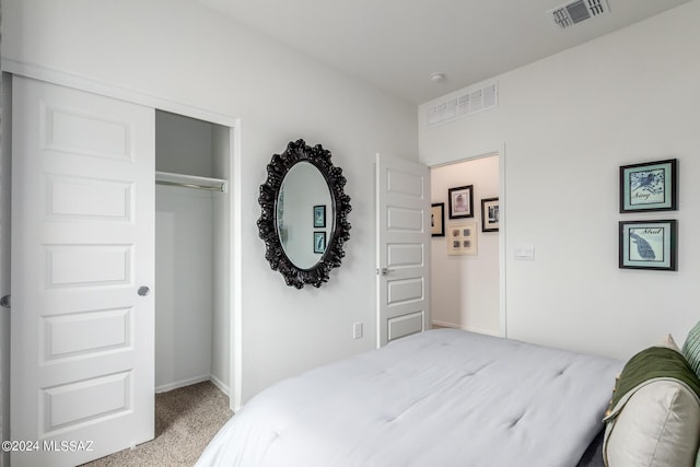 carpeted bedroom with a closet