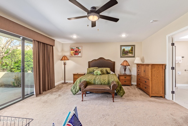 carpeted bedroom with access to outside, ceiling fan, and ensuite bathroom