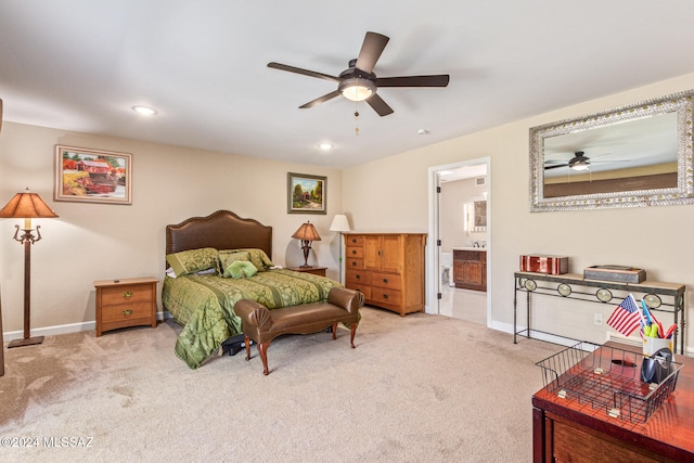 carpeted bedroom featuring ceiling fan and connected bathroom