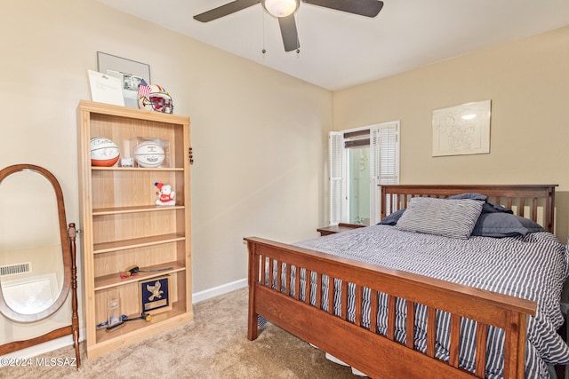 bedroom with ceiling fan and light carpet