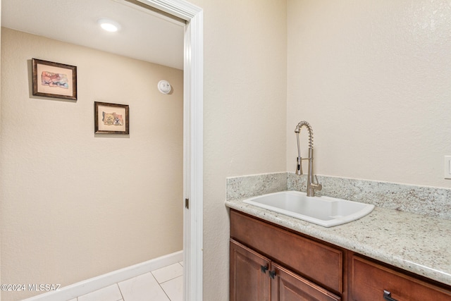 bathroom with vanity and tile patterned flooring