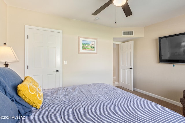 carpeted bedroom featuring ceiling fan