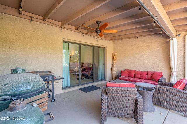 view of patio / terrace with ceiling fan and an outdoor living space