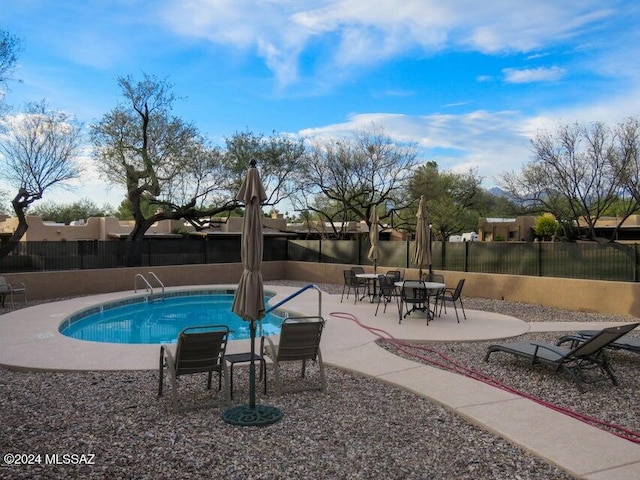 view of pool featuring a patio area