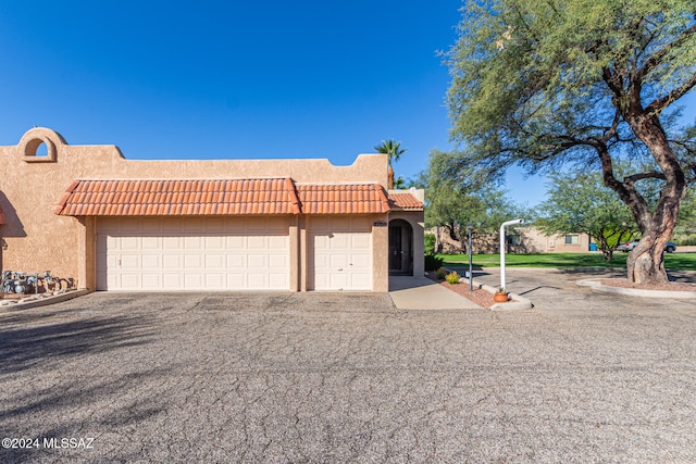 view of front of home with a garage