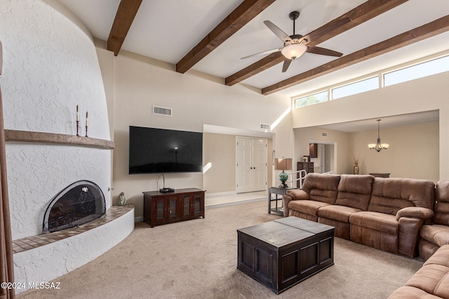 carpeted living room featuring a towering ceiling, ceiling fan with notable chandelier, and beam ceiling