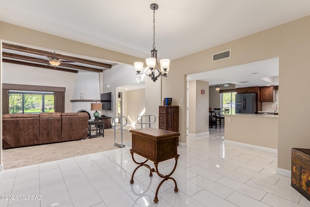 tiled dining space featuring ceiling fan with notable chandelier and beamed ceiling