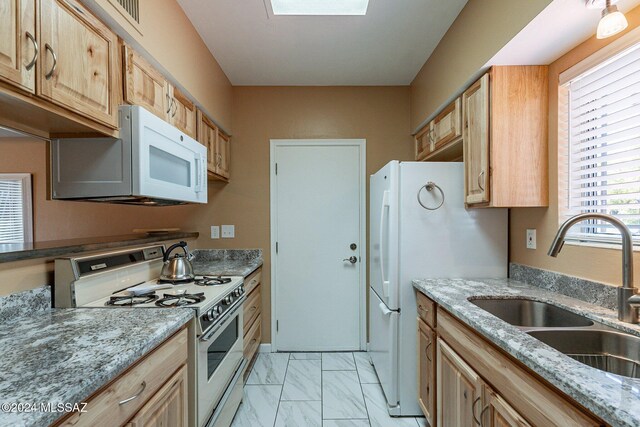 bedroom featuring ceiling fan, brick wall, tile patterned floors, and multiple closets