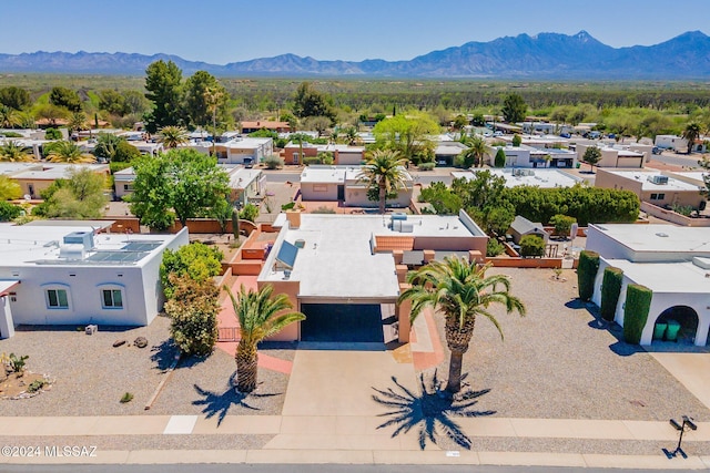 birds eye view of property featuring a mountain view