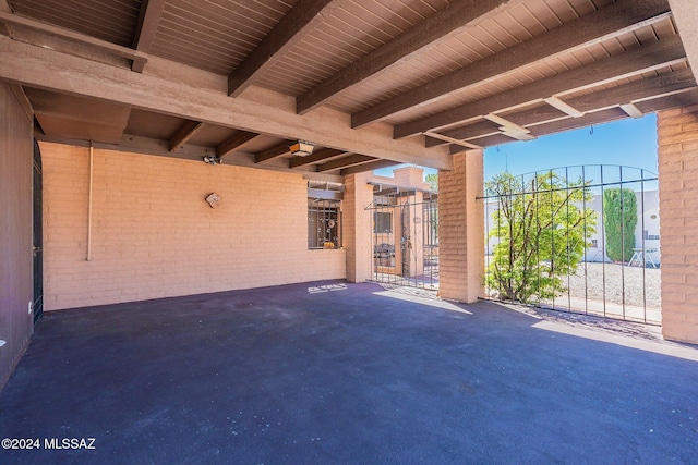 view of patio with a gate