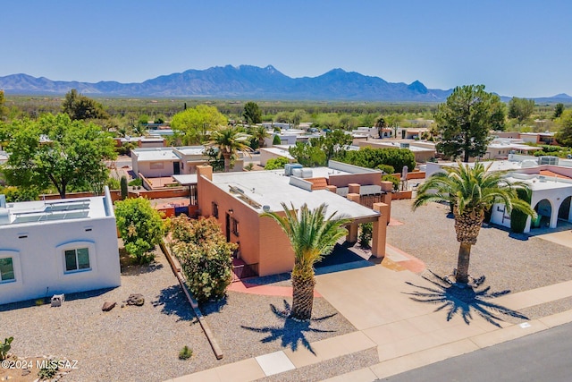 birds eye view of property with a mountain view