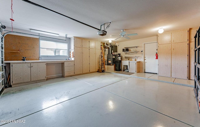 garage featuring a garage door opener and a workshop area