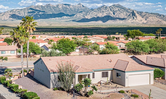 exterior space with a residential view and a mountain view