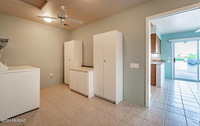 clothes washing area with ceiling fan, light tile patterned flooring, and washing machine and clothes dryer