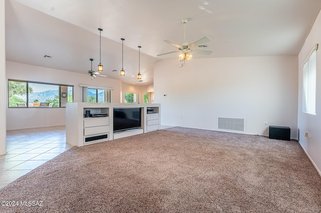 unfurnished living room with high vaulted ceiling, ceiling fan, and light tile patterned floors