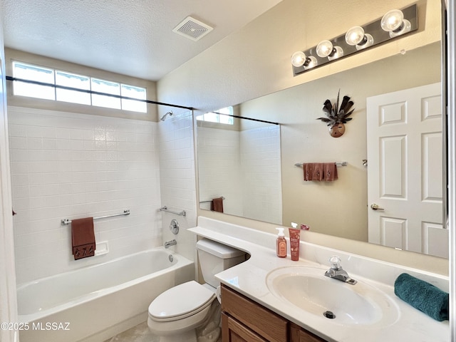 bathroom featuring visible vents, toilet,  shower combination, a textured ceiling, and vanity