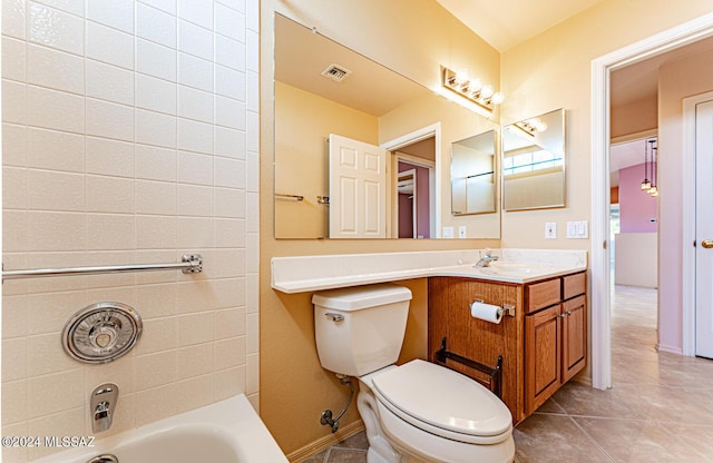 full bath with visible vents, toilet, vanity, baseboards, and tile patterned floors