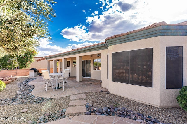 view of patio / terrace featuring a ceiling fan and fence