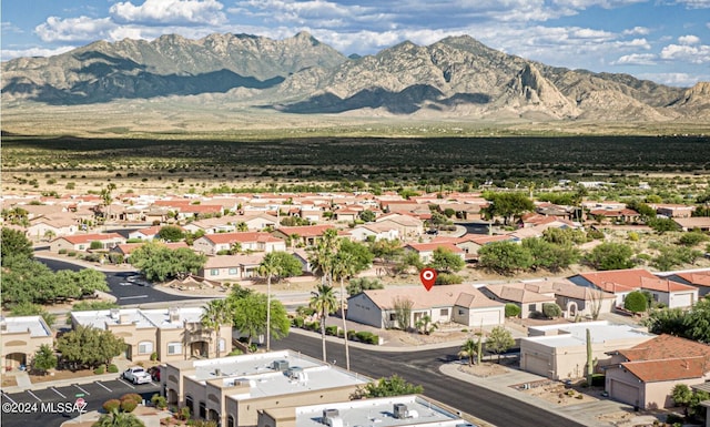 drone / aerial view featuring a residential view and a mountain view