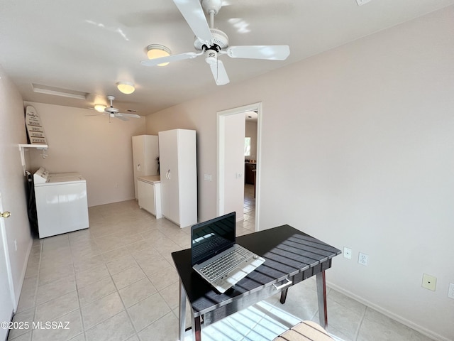 dining room with baseboards, light tile patterned flooring, a ceiling fan, and washer and dryer