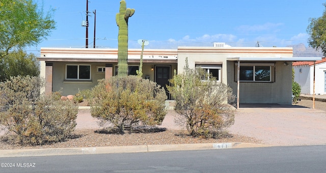 view of front of home with a carport