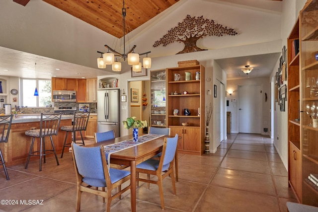 dining area featuring light tile patterned floors, a chandelier, high vaulted ceiling, and wooden ceiling