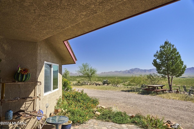 exterior space featuring a rural view and a mountain view