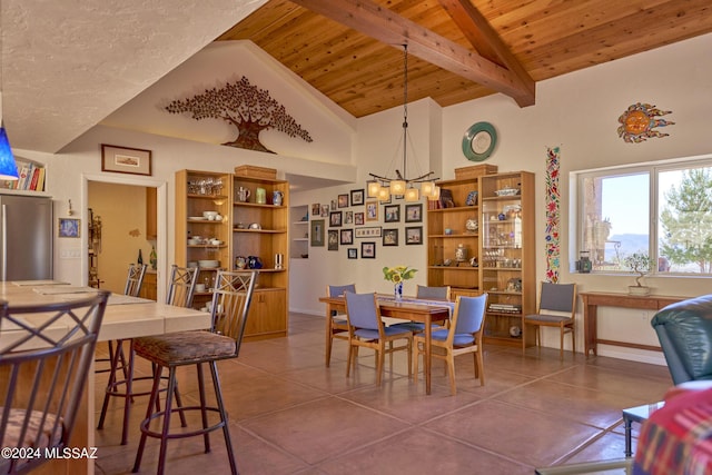 dining room with wood ceiling, dark tile patterned floors, vaulted ceiling with beams, and a notable chandelier