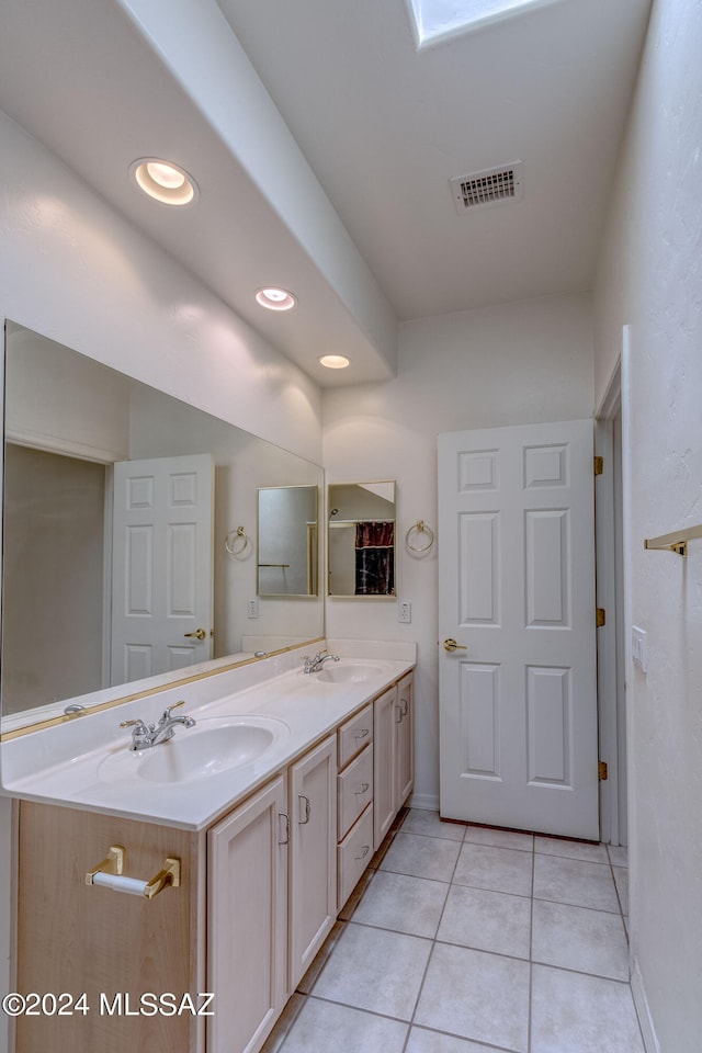 bathroom featuring dual vanity and tile flooring