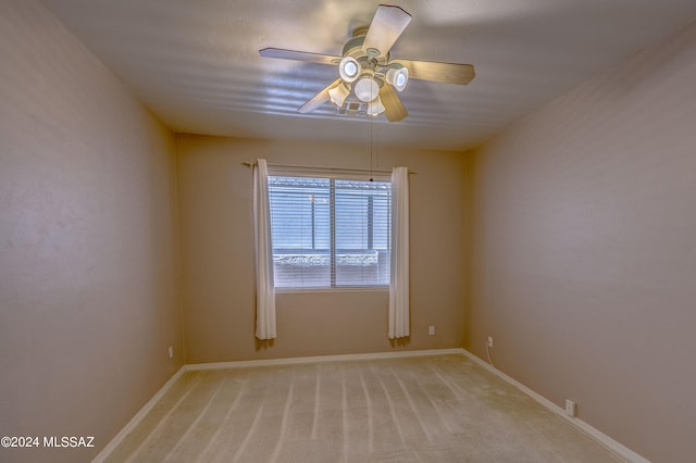 unfurnished room with carpet flooring and ceiling fan