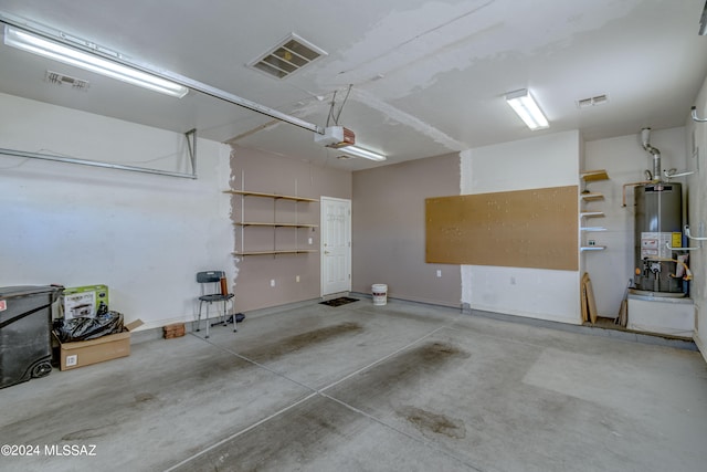 garage featuring a garage door opener and gas water heater