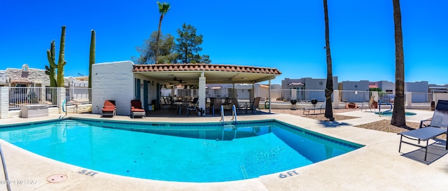 view of pool featuring a patio