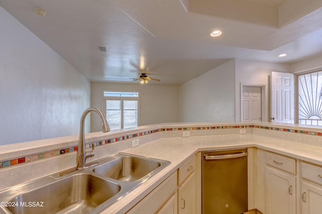 kitchen featuring dishwasher, sink, and ceiling fan