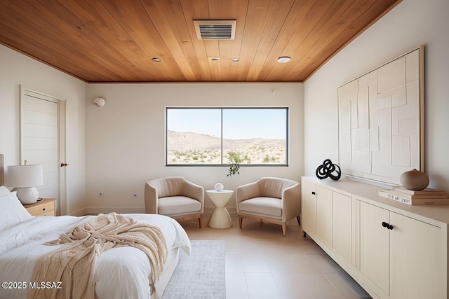 bedroom featuring wood ceiling and a mountain view