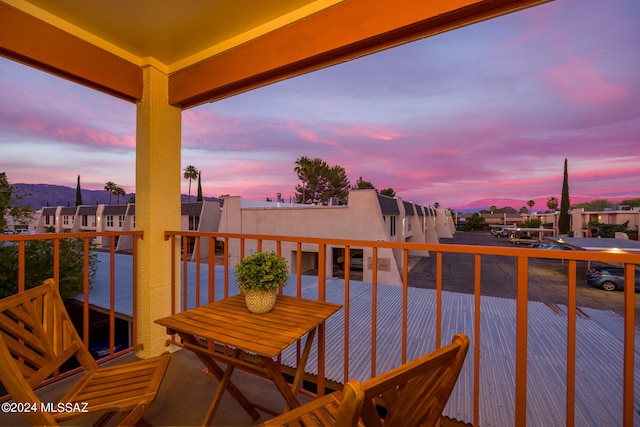 view of balcony at dusk