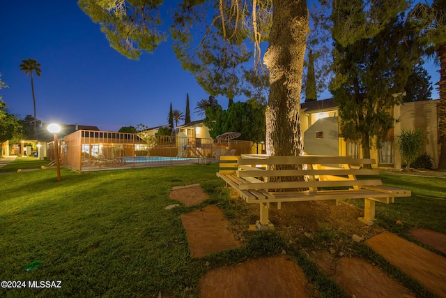 view of yard featuring a fenced in pool