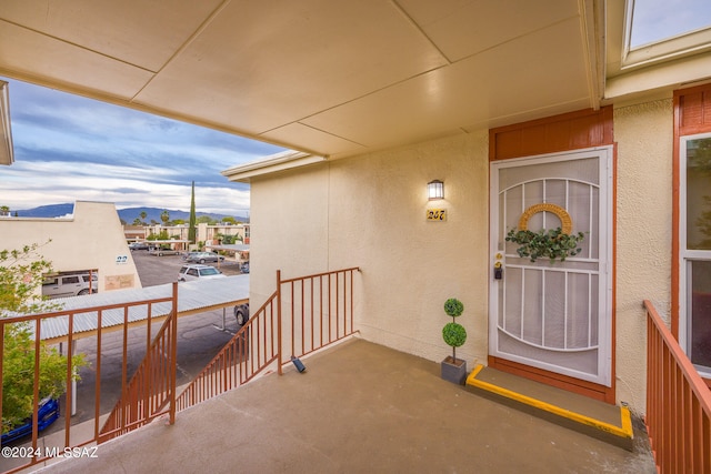 view of exterior entry featuring a mountain view